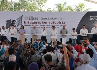 Mexico's President Claudia Sheinbaum cutting a ribbon to open the completed Guadalajara-Puerto Vallarta highway