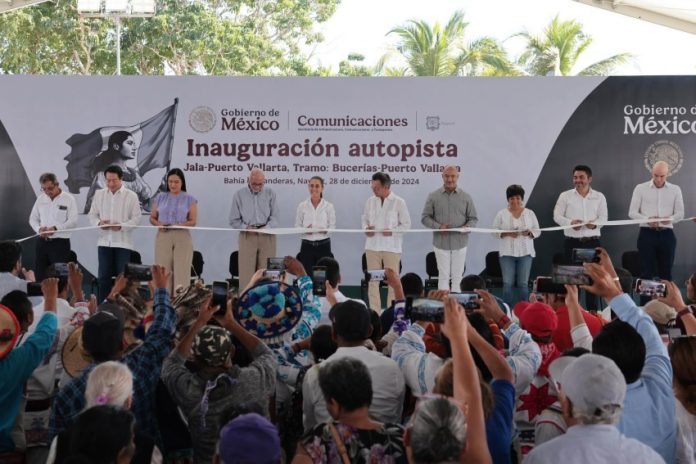 Mexico's President Claudia Sheinbaum cutting a ribbon to open the completed Guadalajara-Puerto Vallarta highway