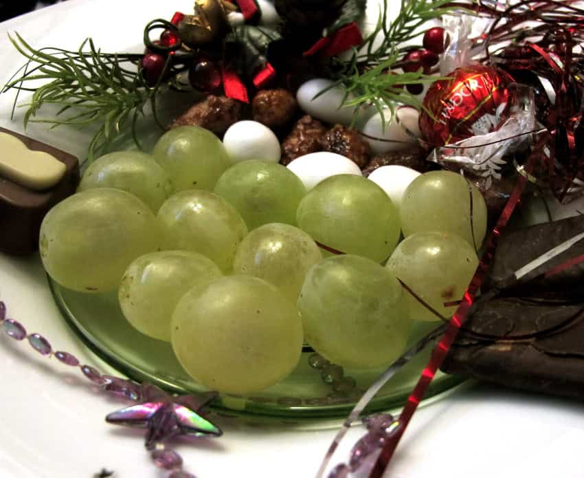 12 green grapes on Christmas-themed plate