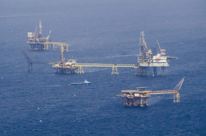 Floating rigs of a Pemex offshore oil drilling field, made possible by suppliers of goods and services