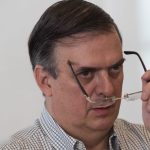 Marcelo Ebrard looks over his glasses