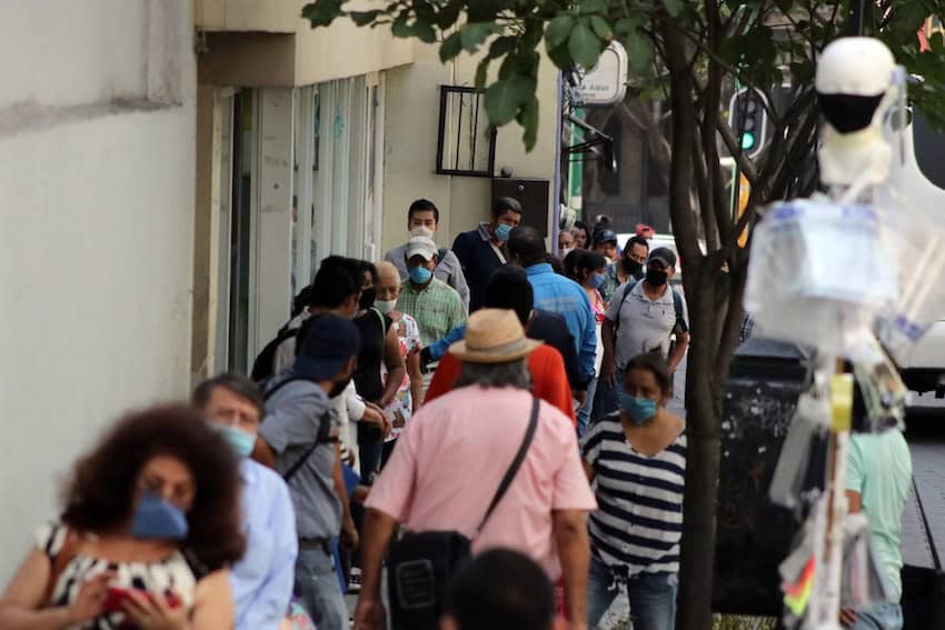 Long queues to carry out transactions at banks in the city centre.