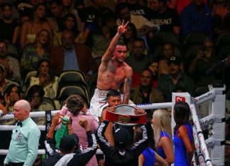 Mexican Gabriel Gollaz Valenzuela celebrates victory over Australian Steve Spark, during a boxing match held at the Akron Stadium in Zapopan.