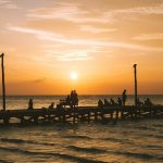 A beautiful sunset in Holbox island's wooden pier.