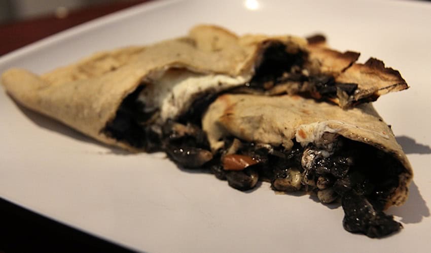 An empanada filled with huitlacoche or Corn Smut. Oaxaca, Oaxaca, Mexico.