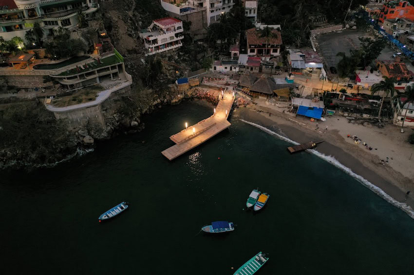 An aerial view of boats near shore in the Costalegre region of Jalisco at night