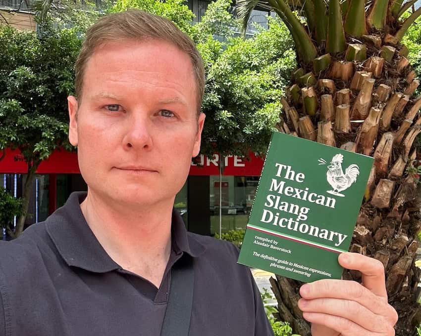 Alasdair Baverstock holding his book