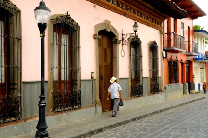 A man walking around in Coatepec's historic center in Veracruz, Mexico.