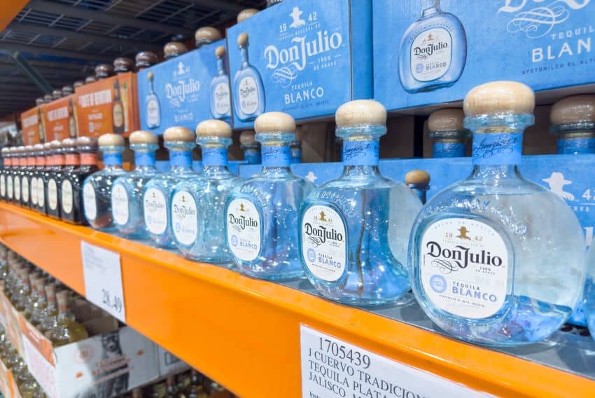 Bottles of Don Julio Mexican tequila sitting on a shelf