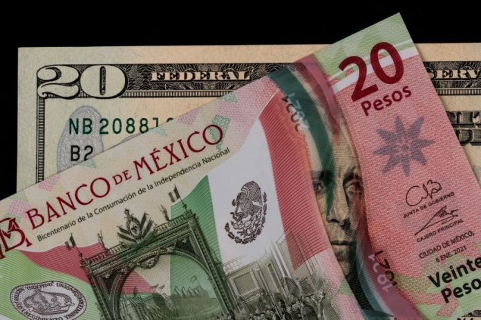 A Mexican 20-peso bill and a U.S. 20-dollar bill on an abstract black background. The Mexican bill is laying over the U.S. bill.