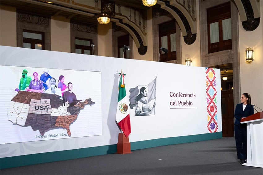 President Claudia Sheinbaum glances back at a map of the United States, surrounded by images of Latino men, women and children.